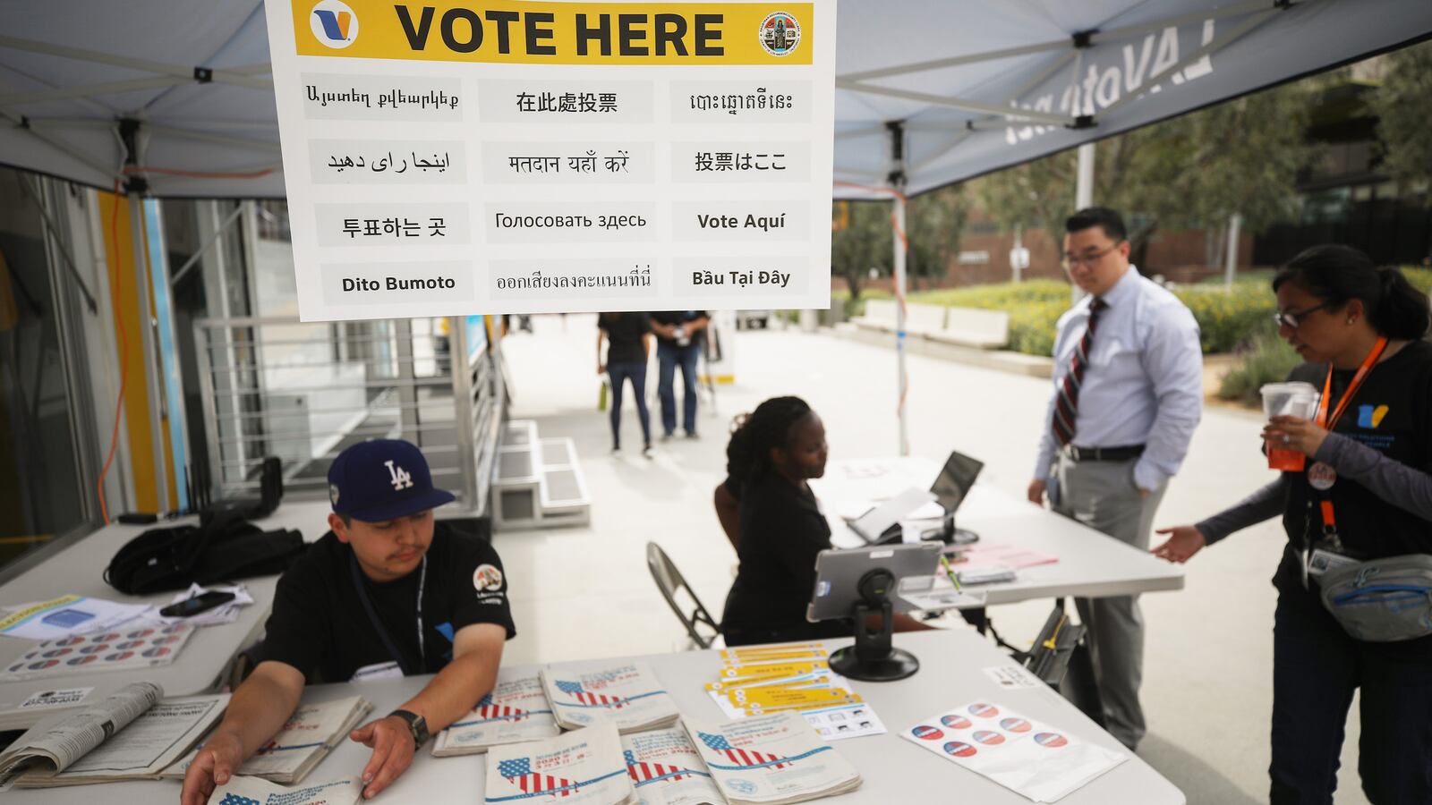 A voter checks in before entering a voting booth during early voting for the 2020 California presidential primary election ahead of Super Tuesday.