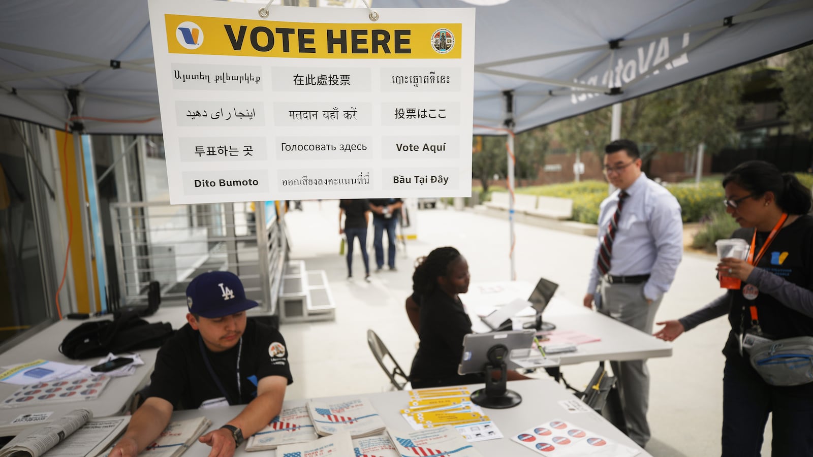 A voter checks in before entering a voting booth during early voting for the 2020 California presidential primary election ahead of Super Tuesday.