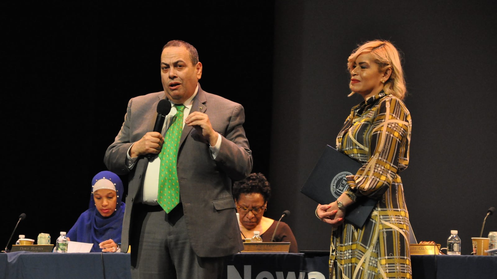 Newark superintendent Roger León, alongside board president Josephine Garcia, addresses the crowd at the November 26, 2019, school board meeting.