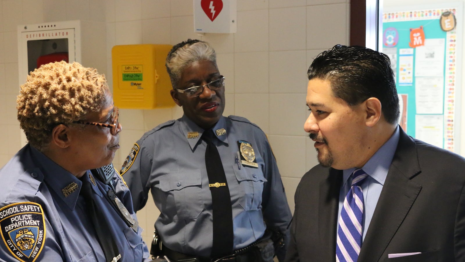 Schools Chancellor Richard Carranza chats with school safety agents on Staten Island.
