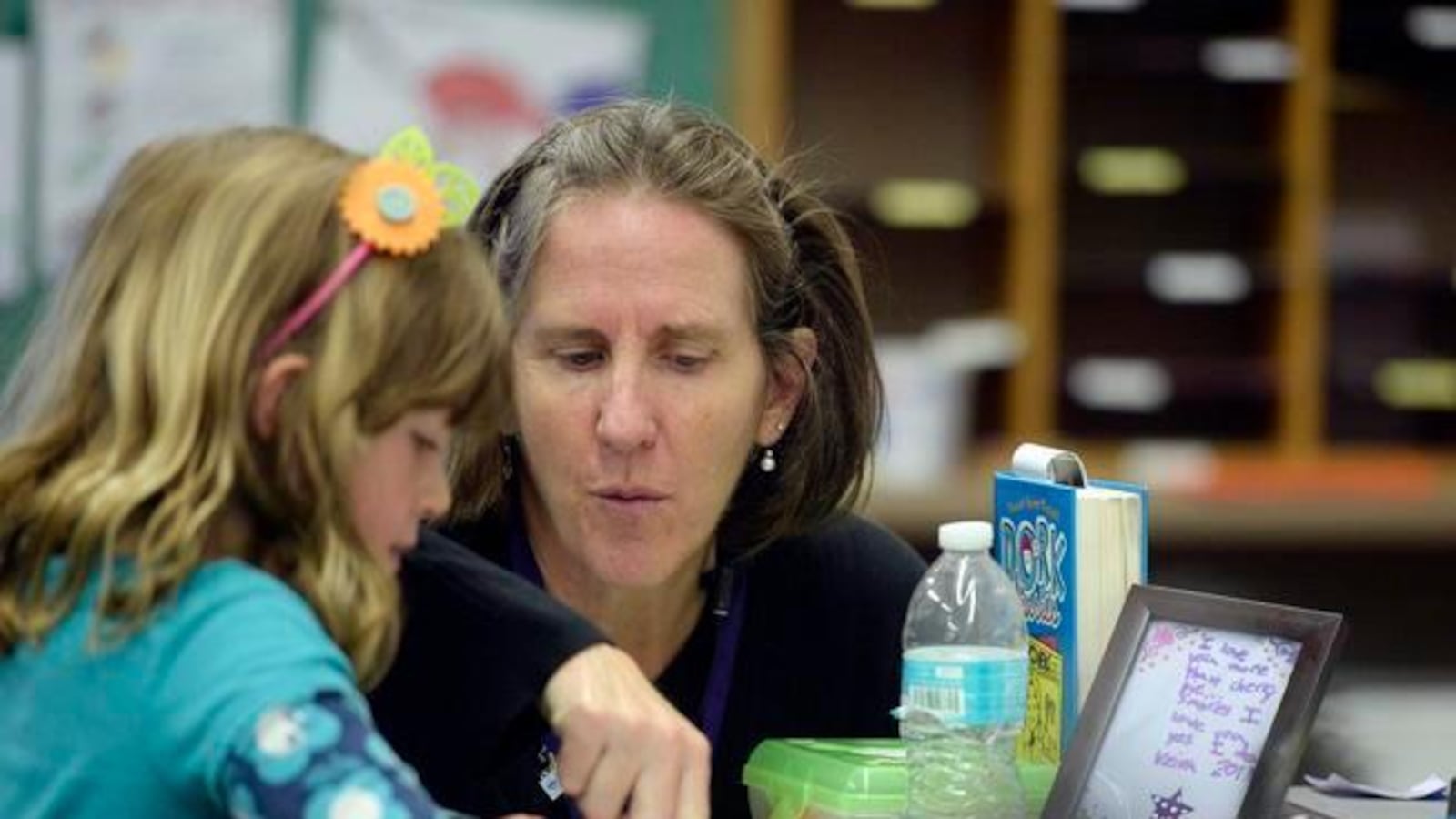 Brown International Academy teacher Kate Tynan-Ridgeway works with a student.