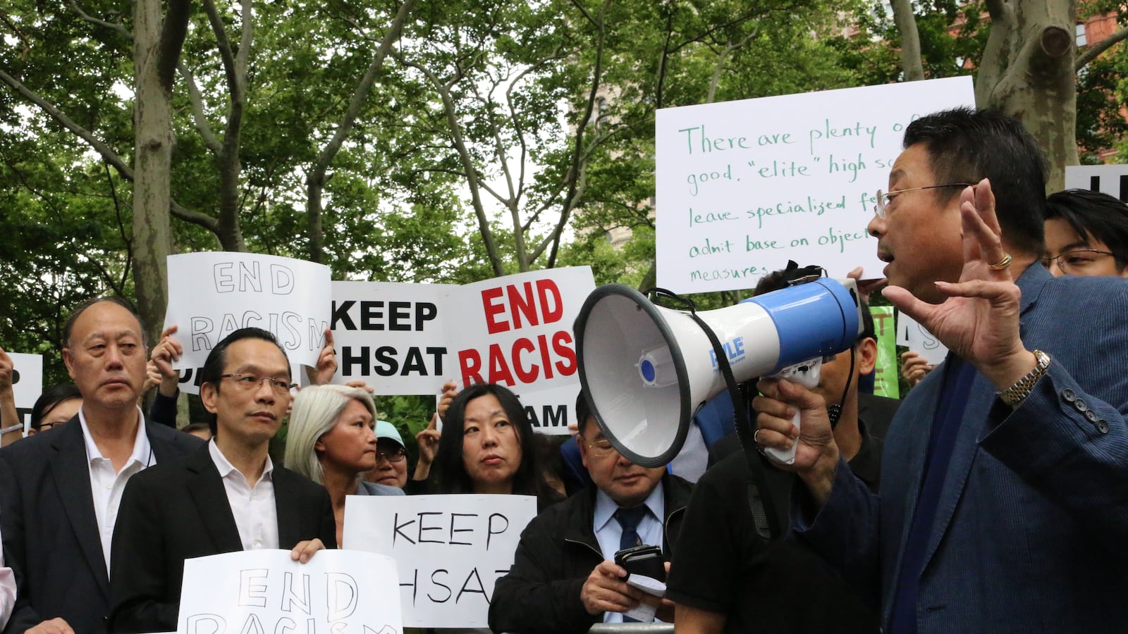 Parents and community members rallied outside City Hall to keep the SHSAT in 2018.