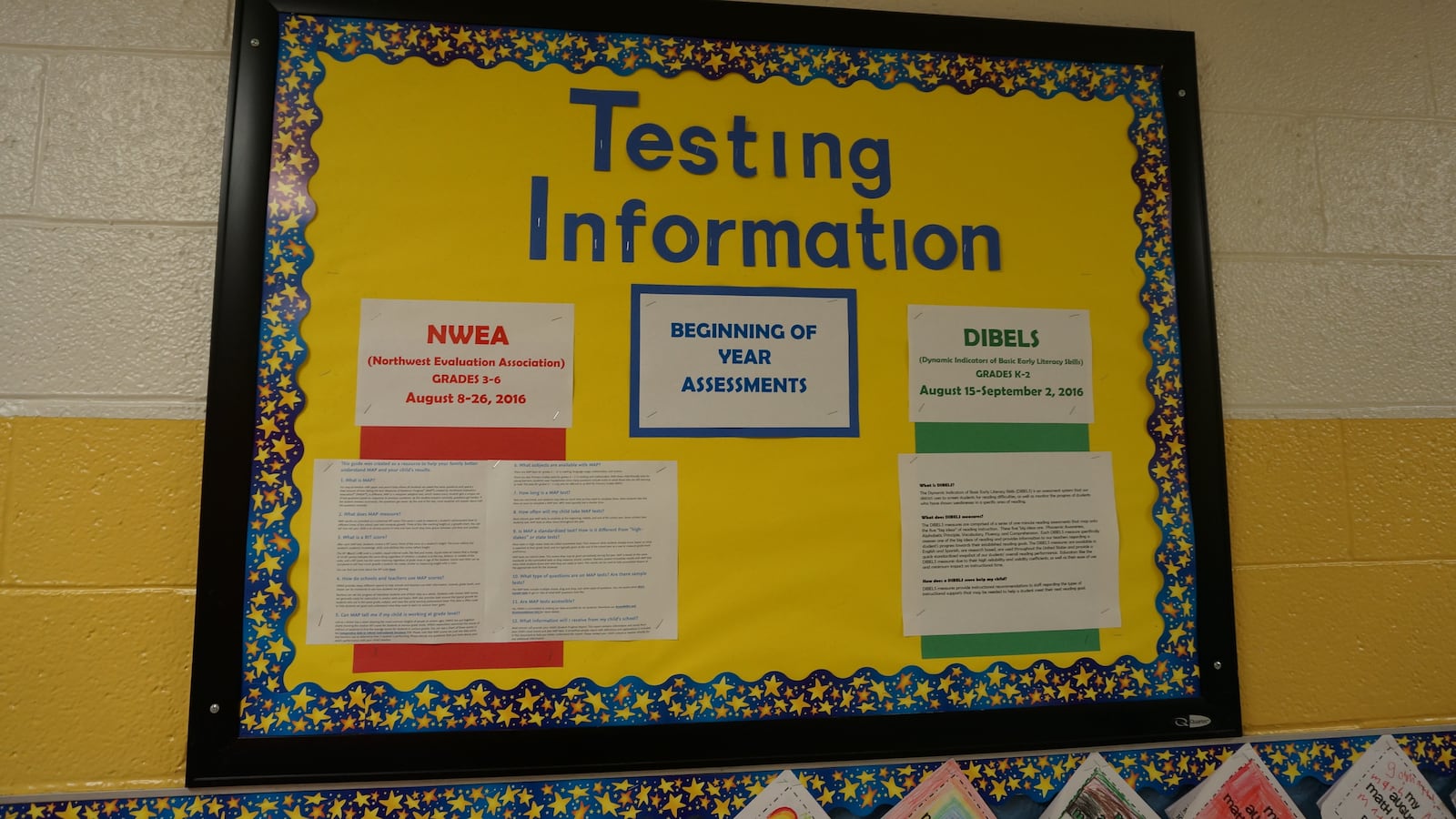 A bulletin board at IPS School 55 details information about testing.