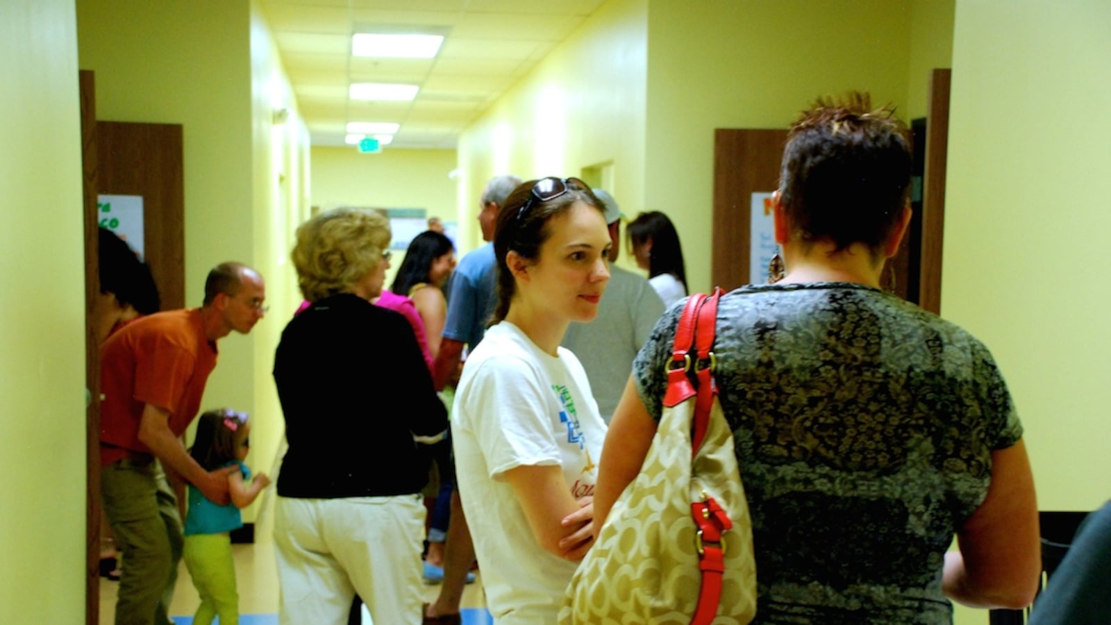 Karen Farquharson, center, meets with a prospective parent June 14 at Montessori del Mundo, a new charter school serving mostly Aurora Public Schools students. When del Mundo opens in August, it will be the first charter school to do so in APS's district in nearly a decade.