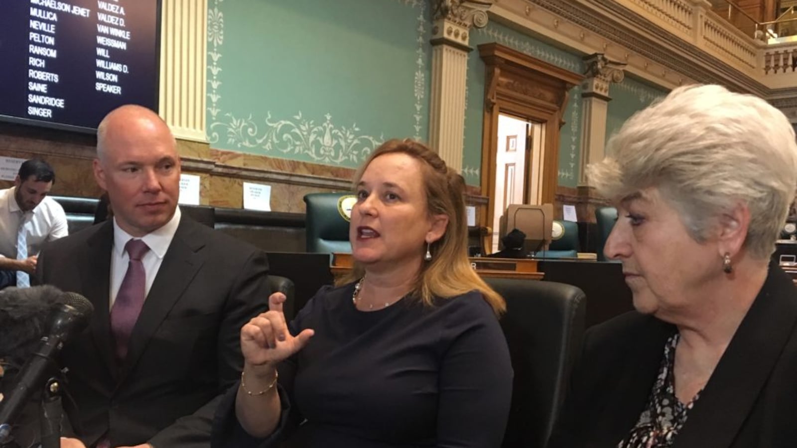 Speaker of the House K.C. Becker, center, describes a proposal to lift the spending cap on state government with state Sens. Kevin Priola and Lois Court.
