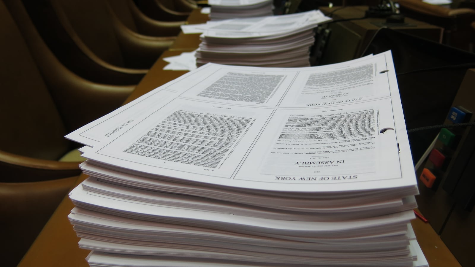 Stacks of legislation sit on the desks of Assembly Members on Sunday night, just days before the official legislative session is scheduled to end.