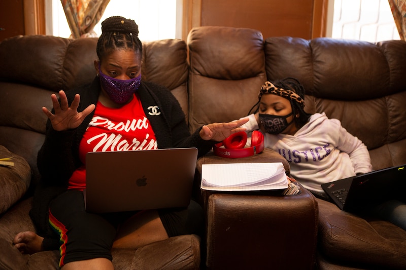 Joicki wears a Chanel brooch given to her by her late husband, a t-shirt that says, Proud Marine Mom and black stretch pants with rainbow stripes on the side for a student who identifies as LGBTQ. Joicki says students pay attention to those details. Donnell’s school day started a little later so she spent some time on the couch with her mom.