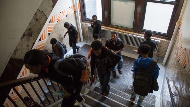 Students pass though a stairwell at Overbrook High School.