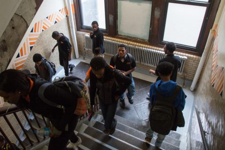Students pass though a stairwell at Overbrook High School.