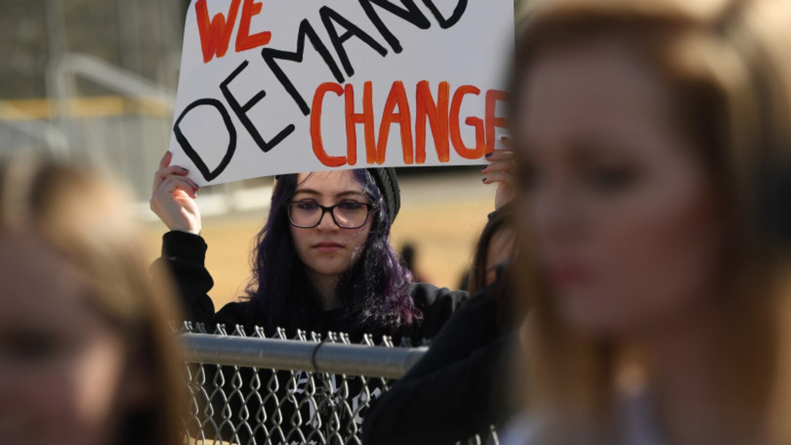 A student at Columbine High School holds a sign during a protest of gun violence, on March 14, 2018 in Littleton, Colorado.