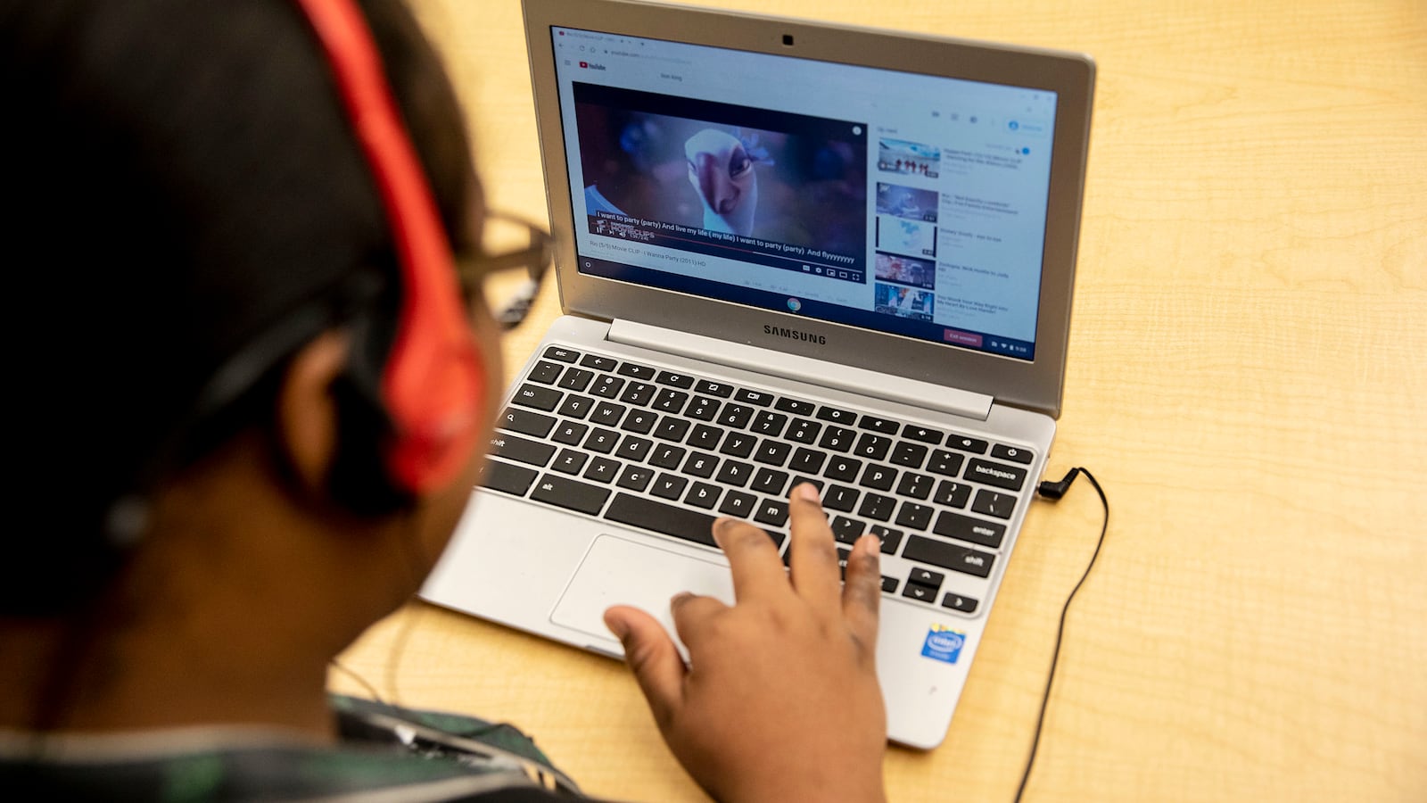 A student works on a laptop computer during a special education classroom exercise.