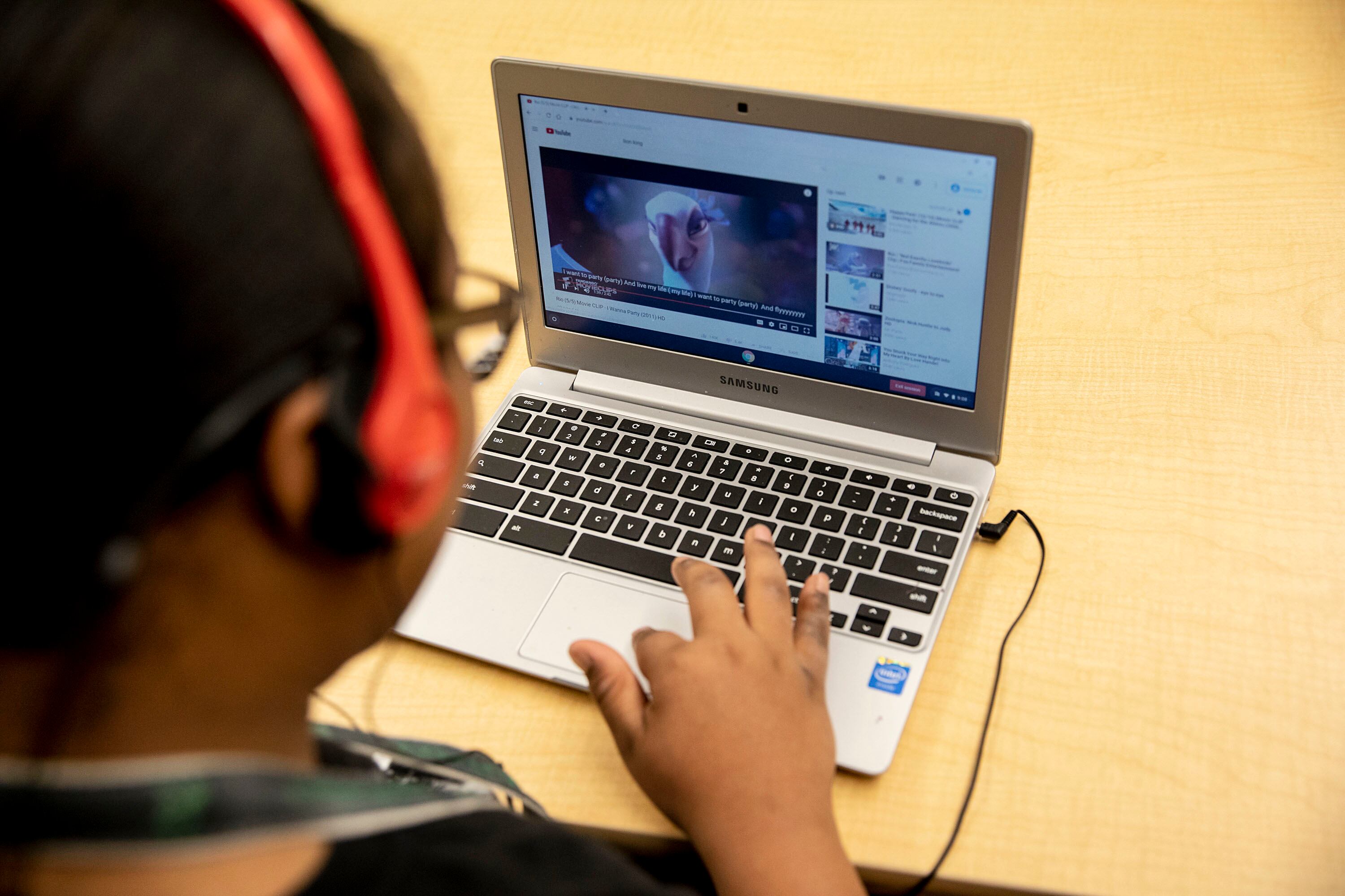 A student works on a laptop computer during a special education classroom exercise.