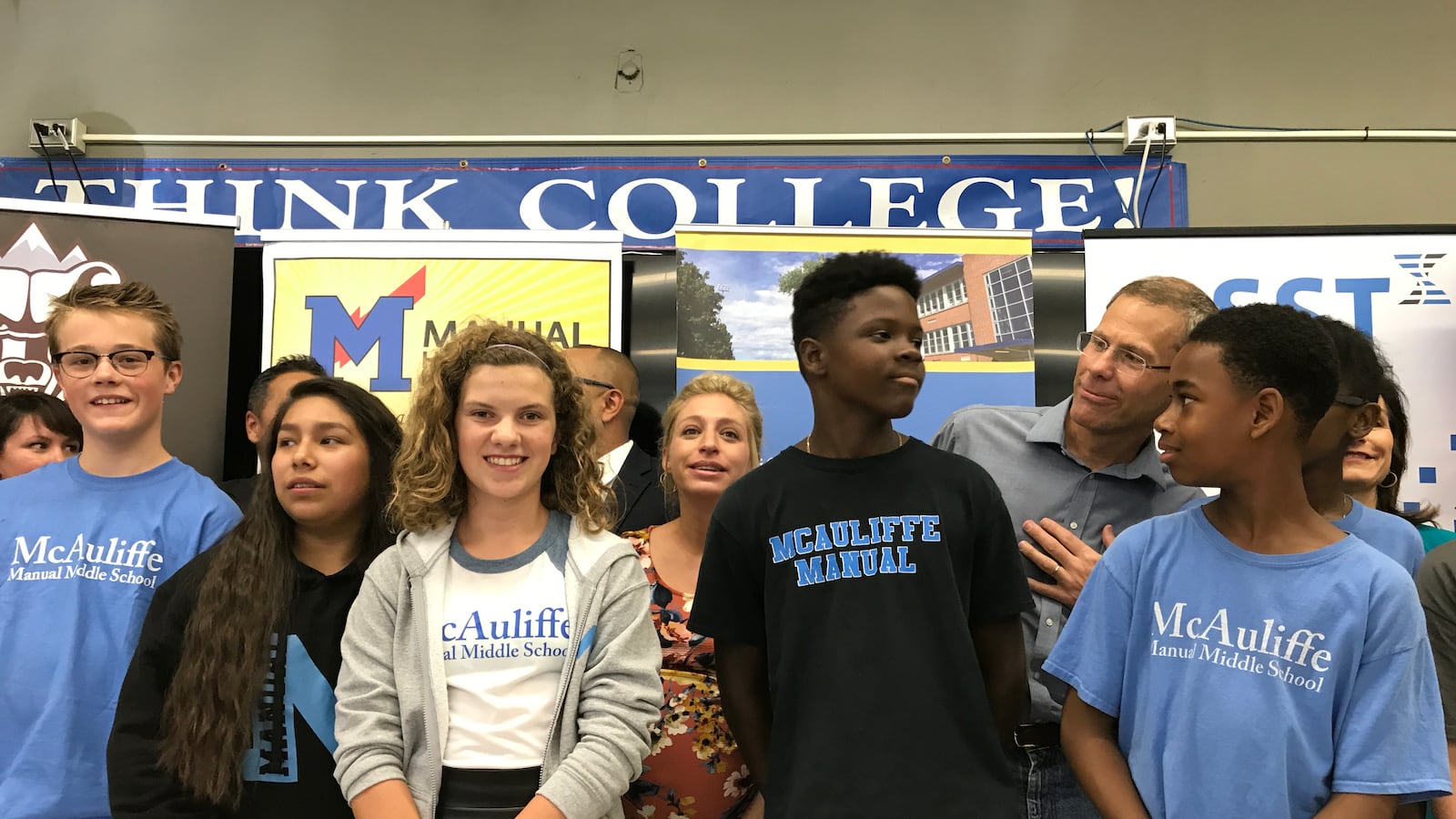 McAuliffe Manual students gather for a photo with Denver Public Schools officials at a press conference in 2017.