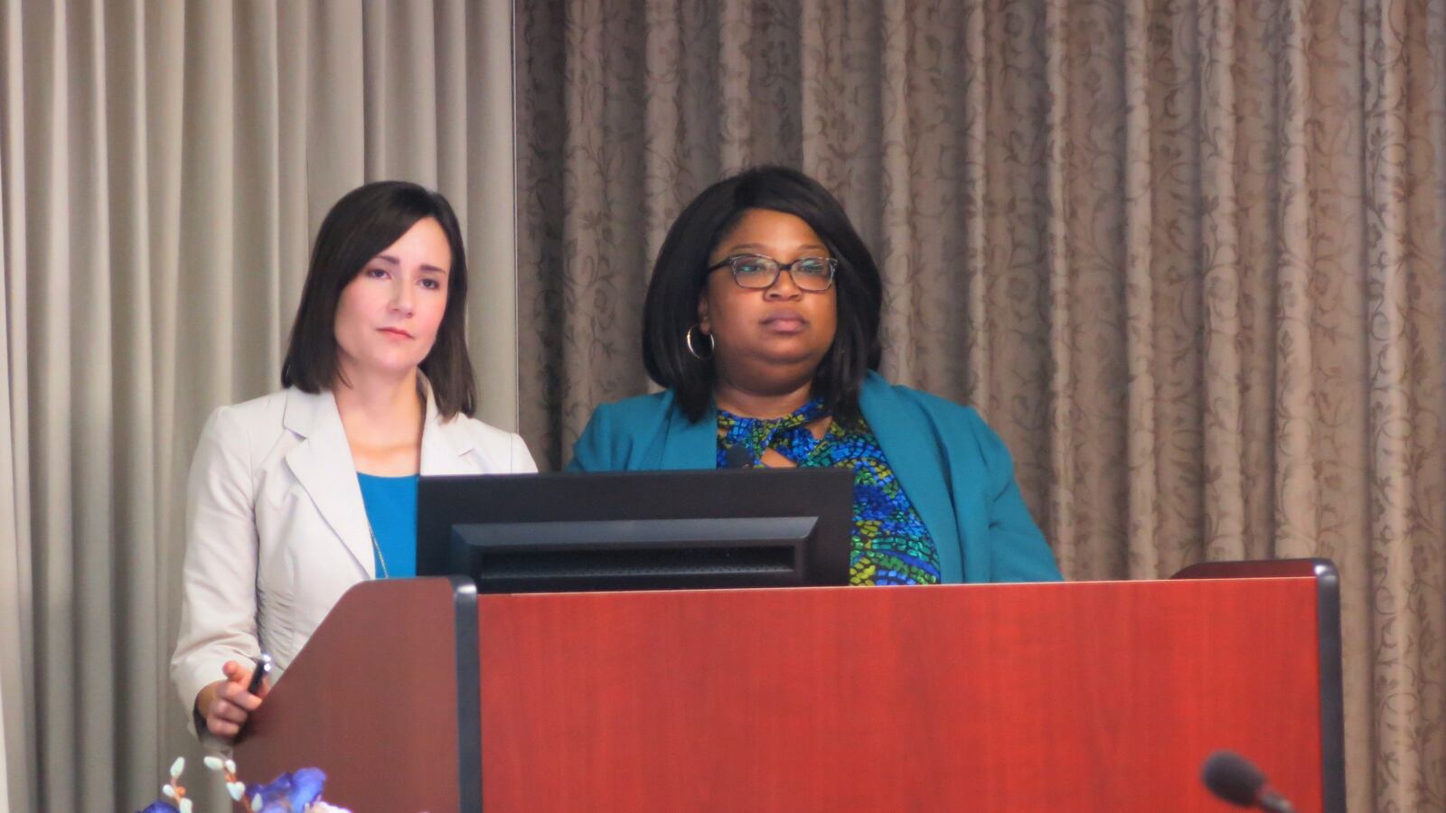 From left: Executive director Sara Heyburn and attorney Elizabeth Taylor present to the State Board of Education last May.