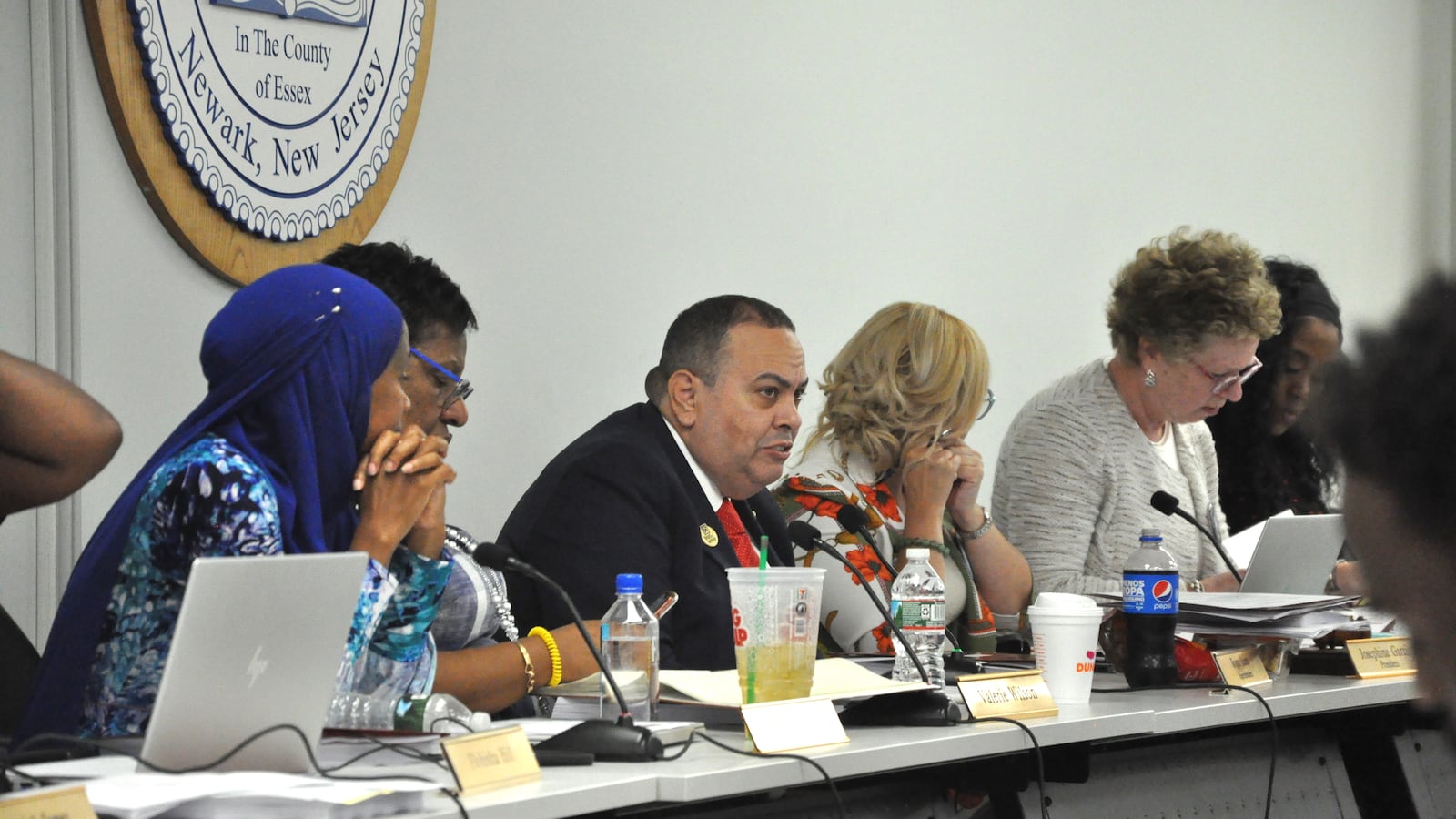 Newark Superintendent Roger León and board members discuss agenda items at the first board meeting of the school year.