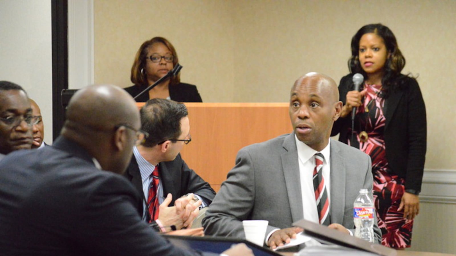 Superintendent Dorsey Hopson confers with staff.