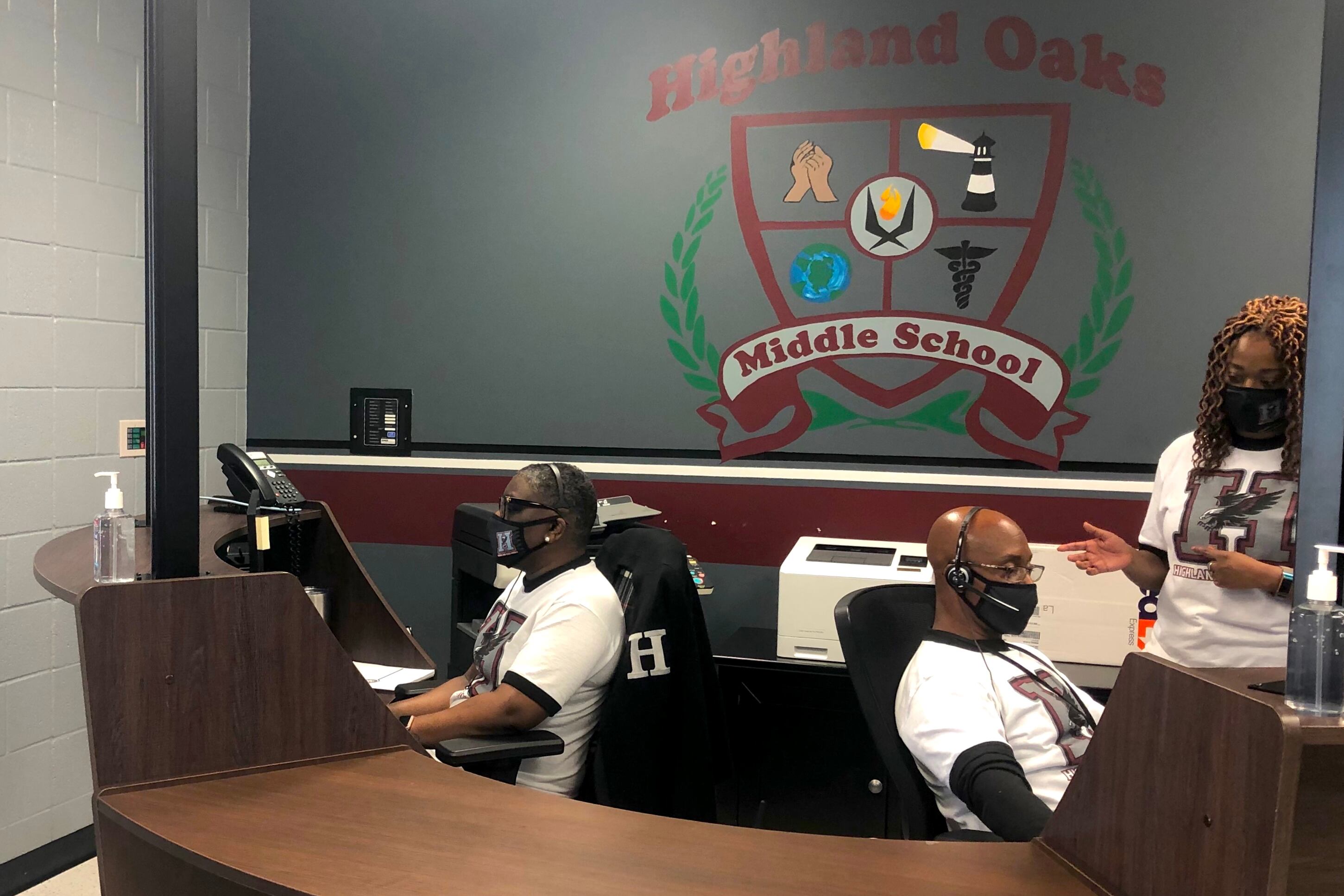Secretaries answer parent phone calls from the Highland Oaks Middle School front office