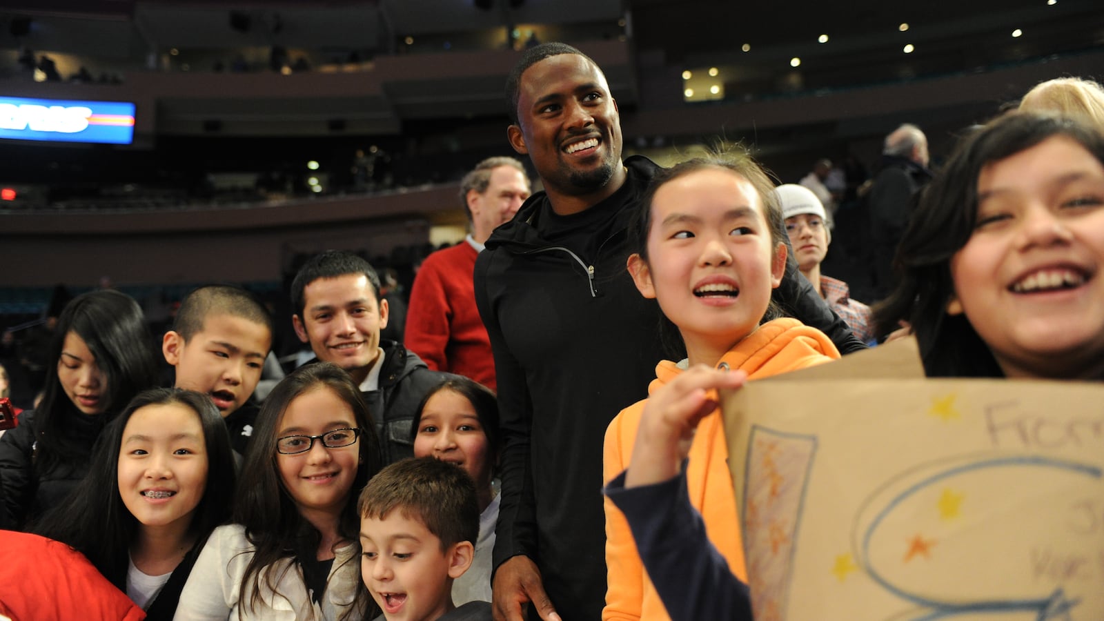 Track and field star David Oliver joined students from 51st Avenue Academy at Madison Square Garden in 2012.