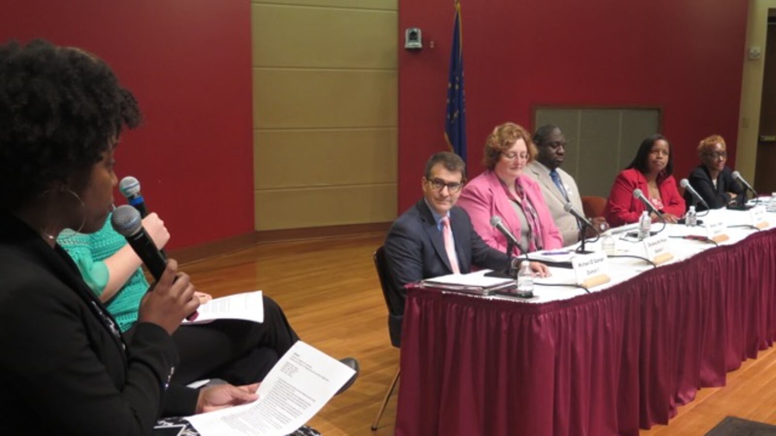 The Indianapolis Recorder's Ebony Chappel asks a question to candidates for IPS school board at Wednesday's candidate forum.