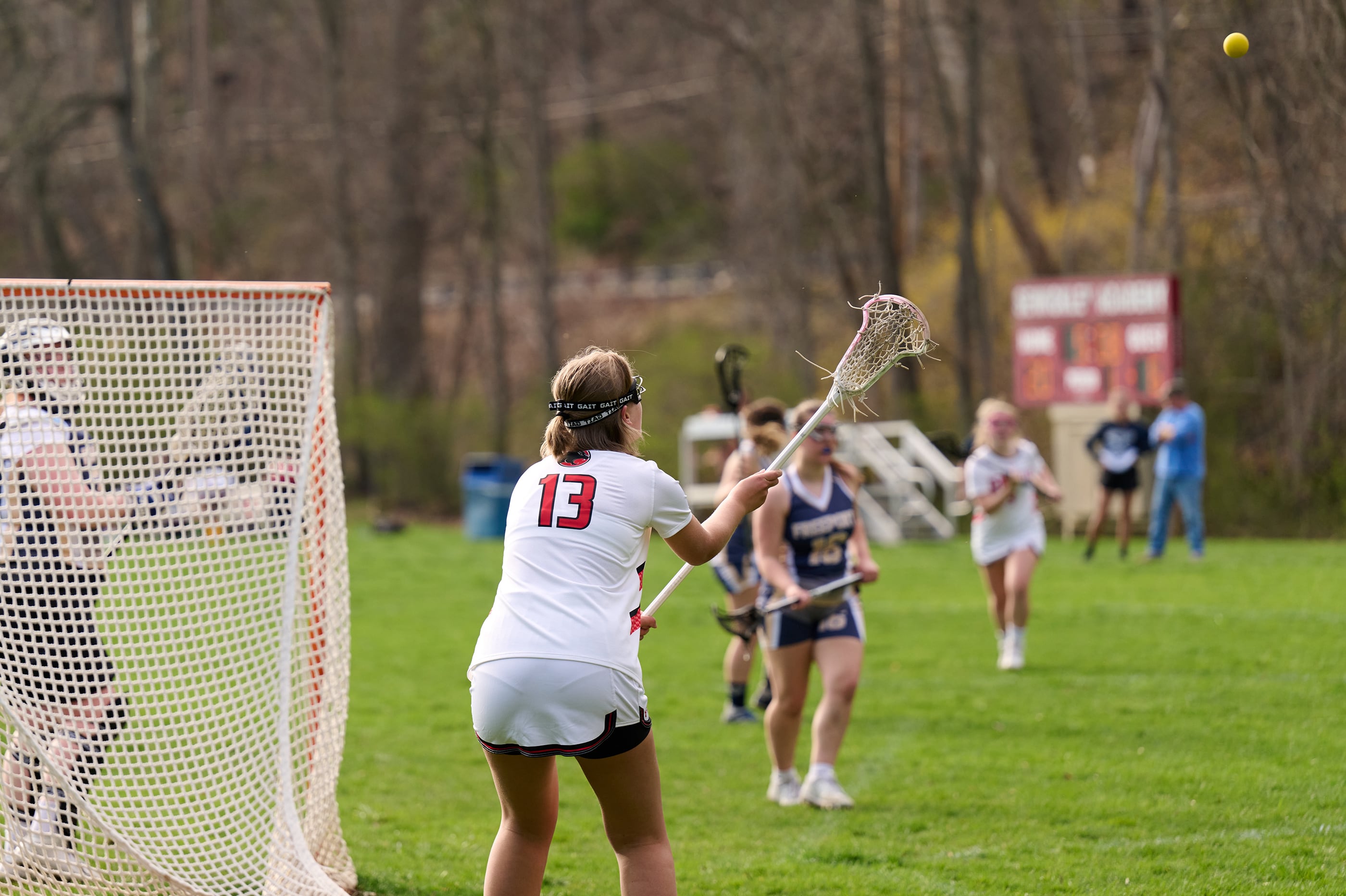 A high school girls lacrosse game.