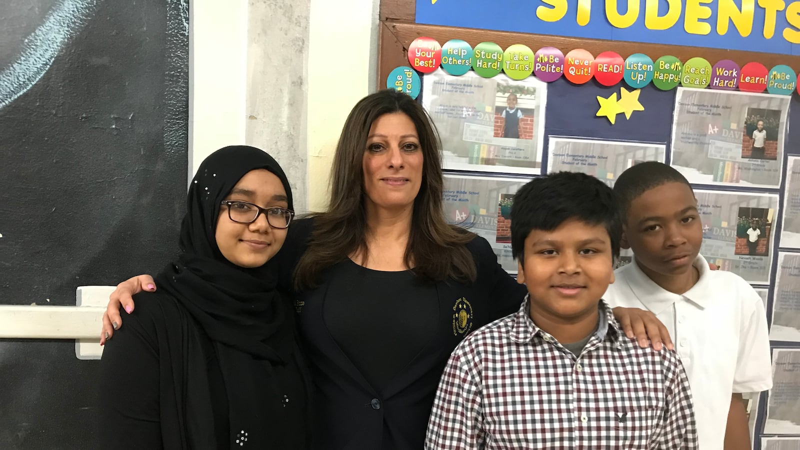 Teacher Michele Pizzo and students Wajiha Begum, Iftiker Choudhury and Demetrious Yancy are closer since she's visited their homes