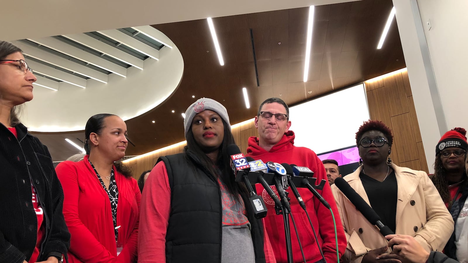 Chicago Teachers Union officers Stacy Davis Gates, second from left, and Jesse Sharkey stand among bargaining team members during a press conference after bargaining Oct. 27, 2019, at Malcolm X College.