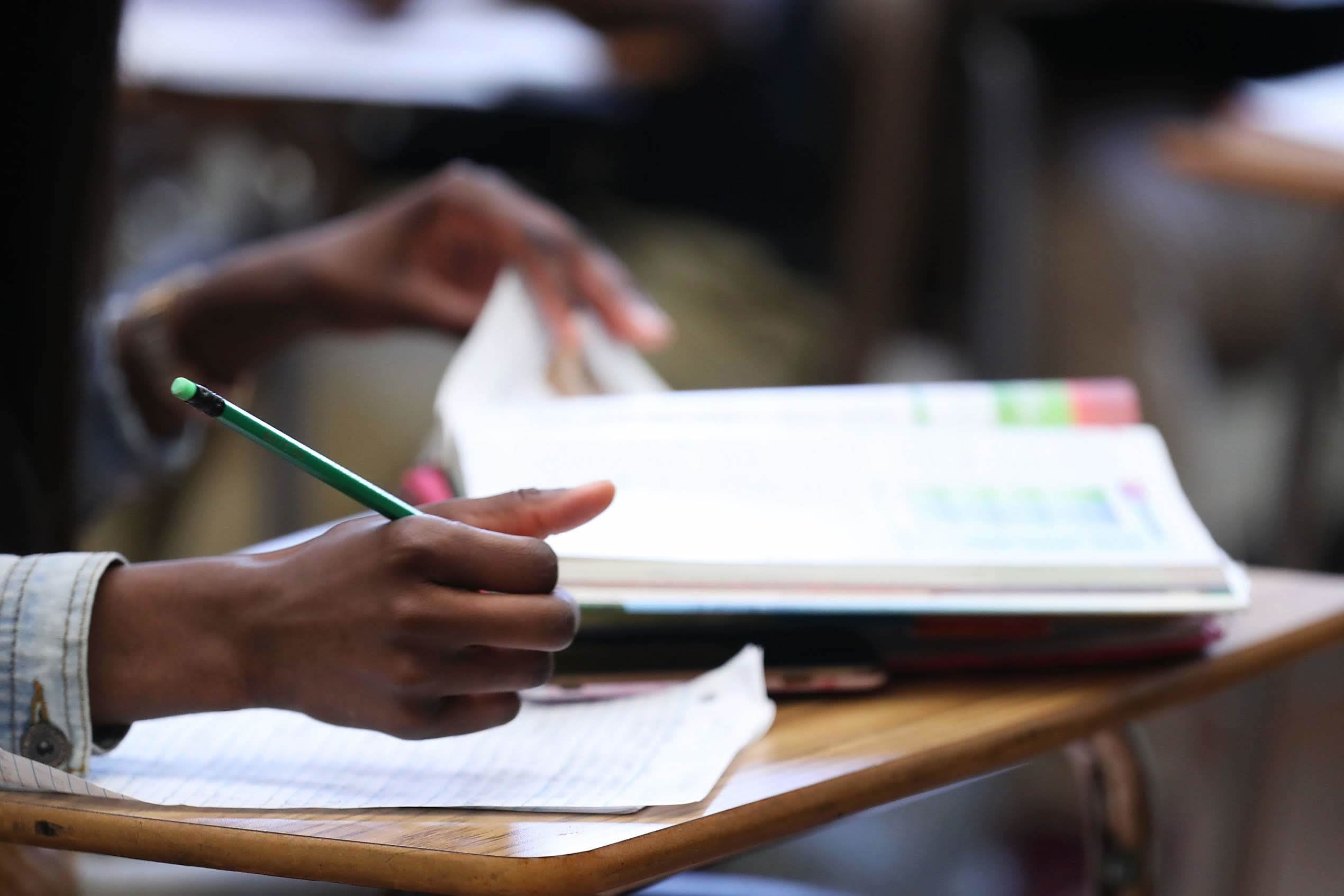 Female student in classroom, working at desk in Hillcrest High School in Memphis, Tennessee