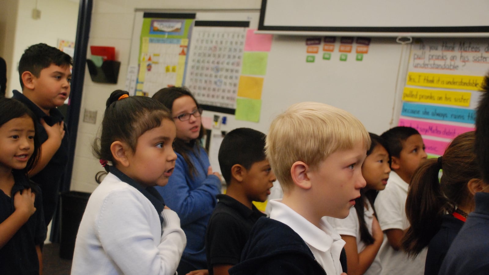 Third graders recite the pledge of allegiance in class at Thornton Elementary School.
