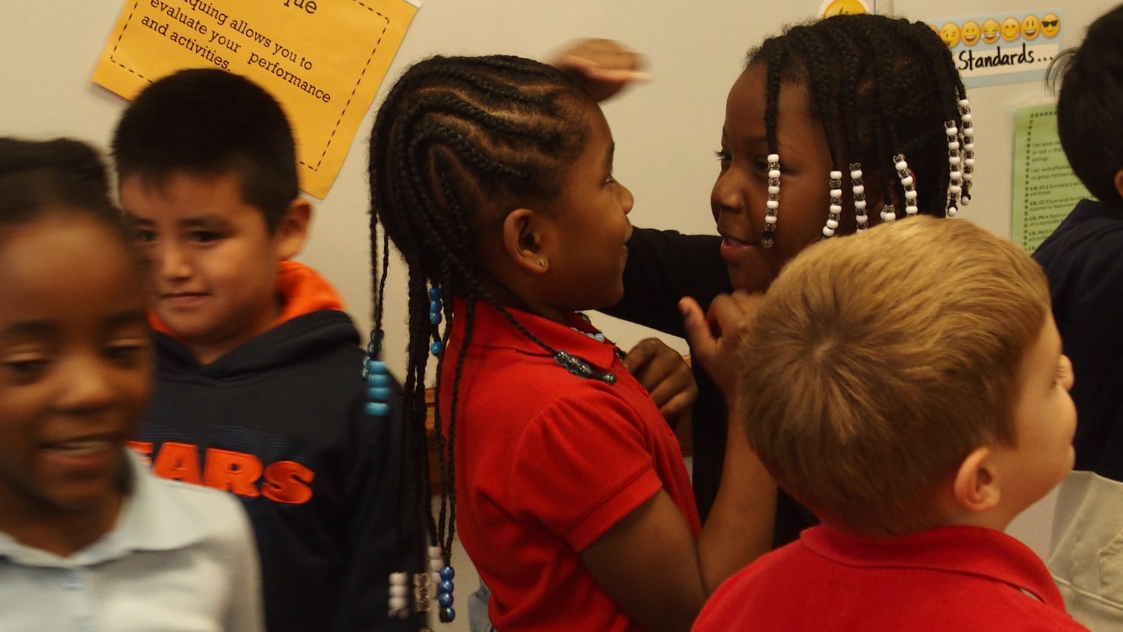 Kindergarten and first grade students in Treadwell Elementary's new gifted education class compare each other's height to get in line from shortest to tallest.