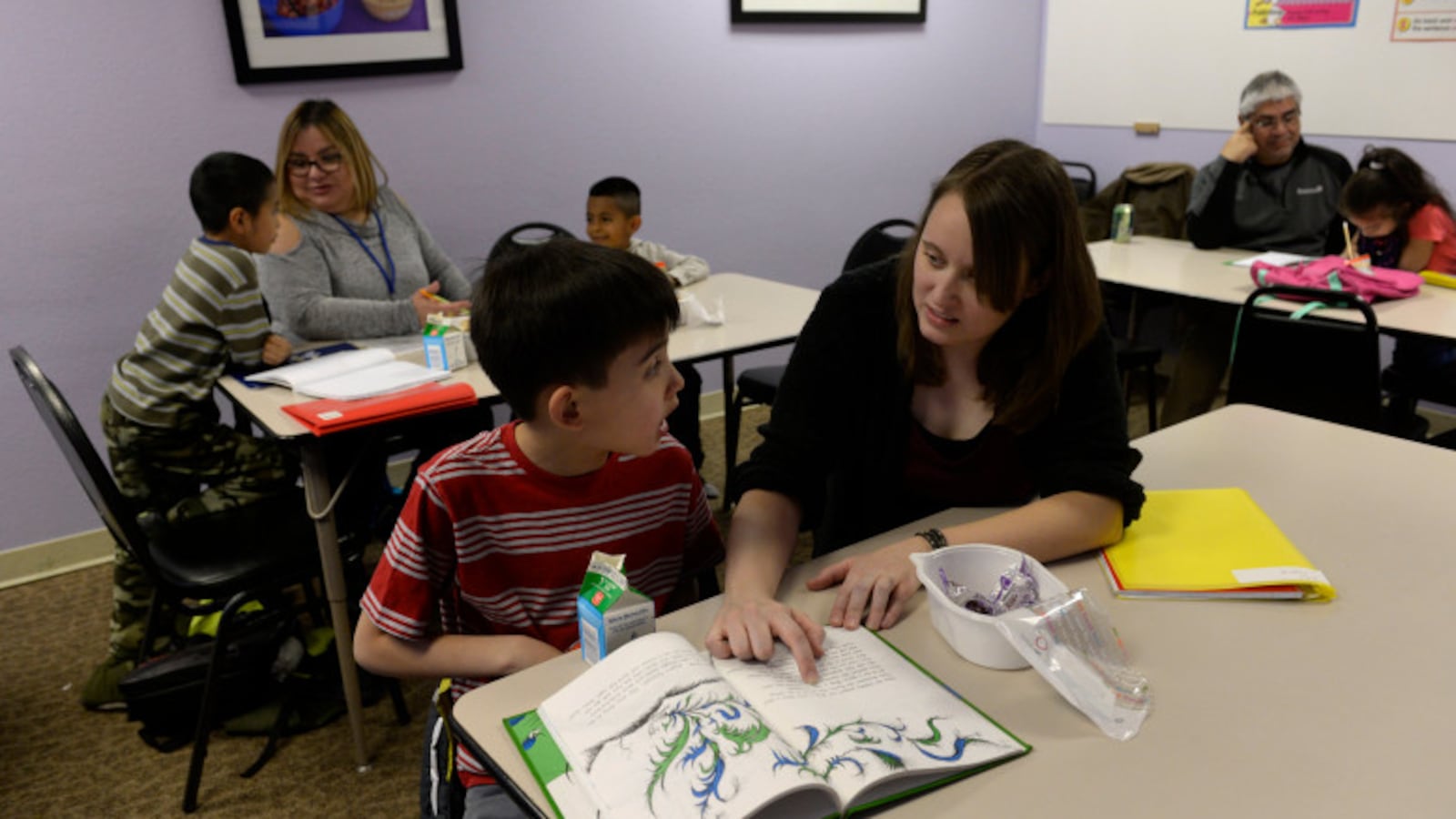 A reading lesson this spring at an Aurora family resource center. (Kathryn Scott, The Denver Post).