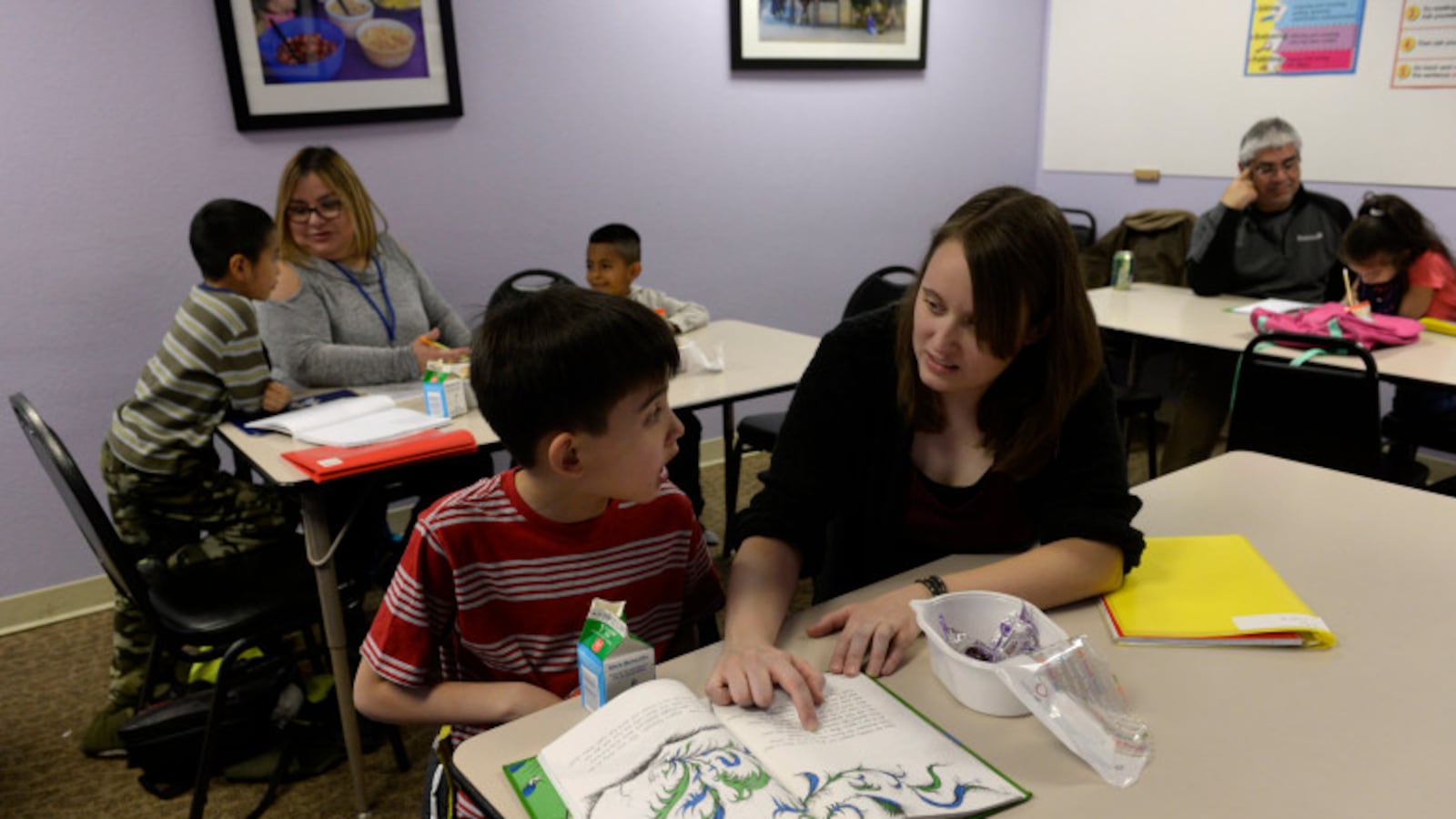 A reading lesson this spring at an Aurora family resource center. (Kathryn Scott, The Denver Post).