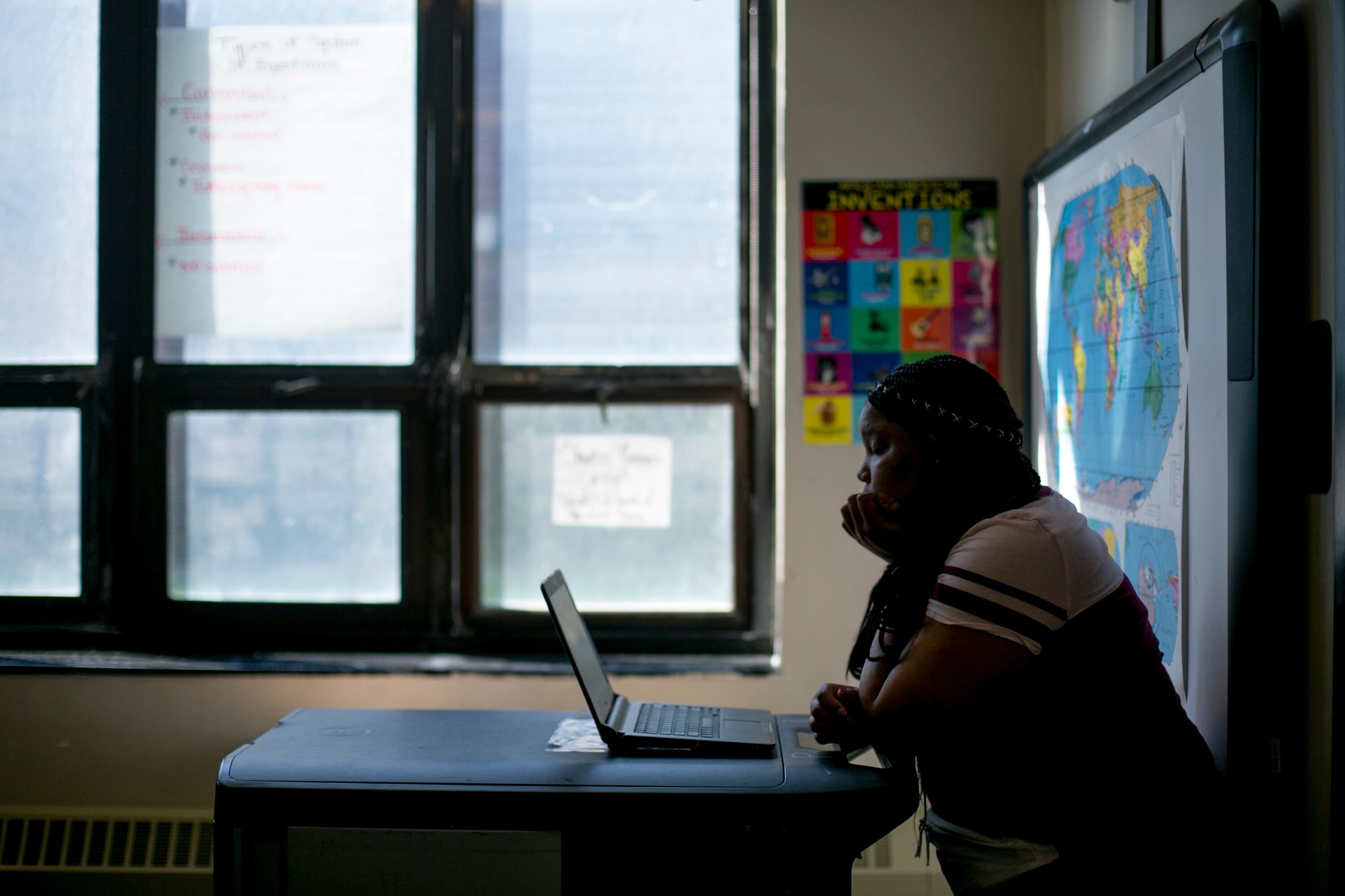 A student works on a laptop computer in a math class at Southeastern High School in Detroit.