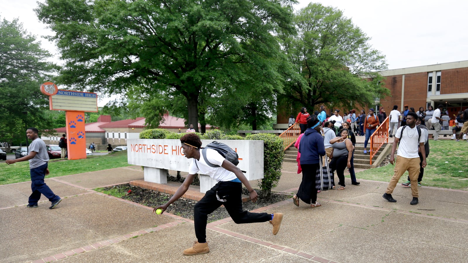 Samone Nelson chases down a tennis ball as he leaves Northside High School last spring, before the high school was shuttered. Once one of the largest high schools in Memphis, Northside had just 190 students during its final year of operation.