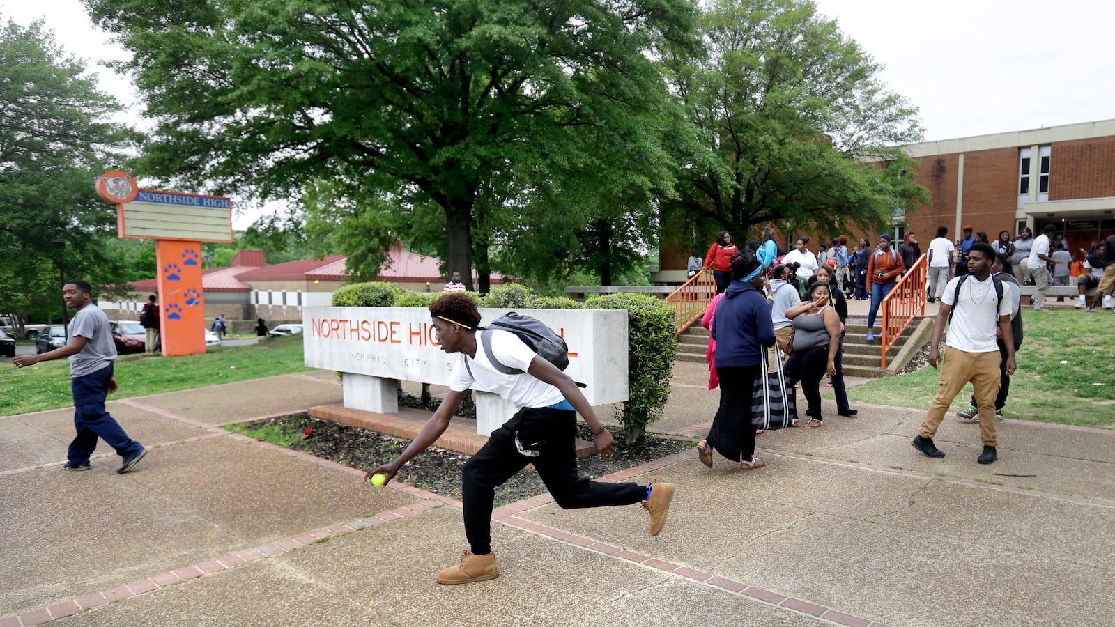 Samone Nelson chases down a tennis ball as he leaves Northside High School last spring, before the high school was shuttered. Once one of the largest high schools in Memphis, Northside had just 190 students during its final year of operation.