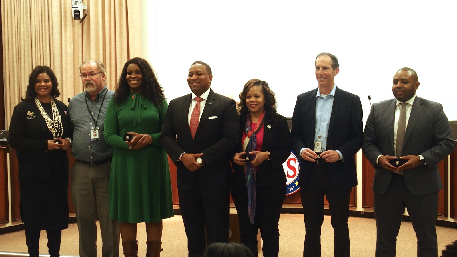 Superintendent Joris Ray, center, honors long-serving school board members at a meeting last week. From left, Miska Clay Bibbs, Scott McCormick, and Stephanie Love are up for re-election this year. Shante Avant and Billy Orgel won re-election in 2018. Kevin Woods, right, is not seeking re-election.