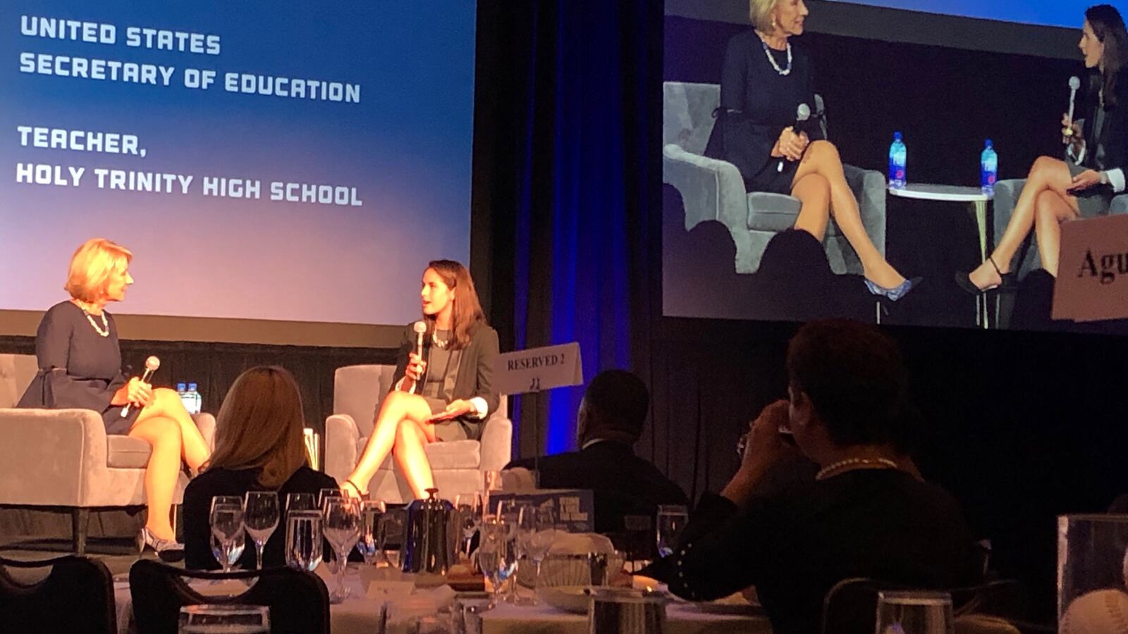 U.S. Secretary of Education Betsy DeVos, left, speaks with Kate Hardiman, a teacher at Holy Trinity High School in Chicago, on May 2, 2019, at the American Federation for Children's national policy summit in downtown Chicago.