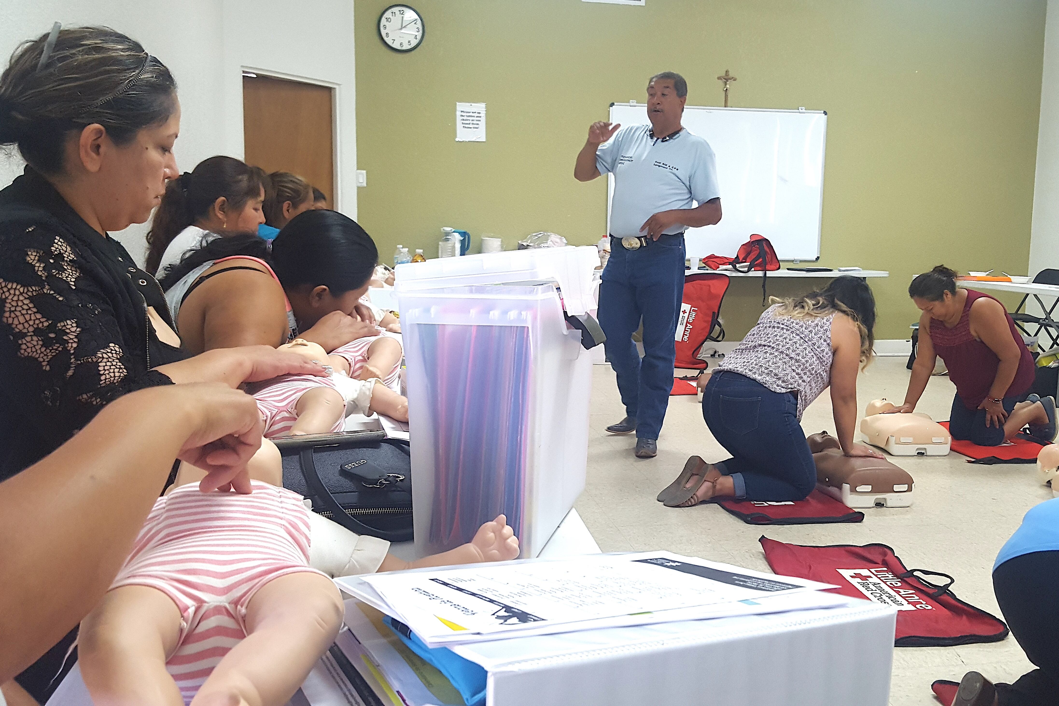 Members of the PASO class practice CPR and first aid during a session in July.