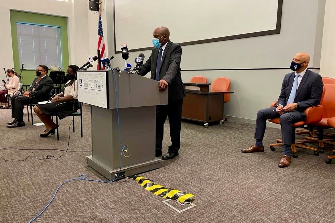 Ryan “Smitty” Smith, standing, is a safety officer at Kensington Health Sciences Academy. To the right is Philadelphia Superintendent William Hite.
