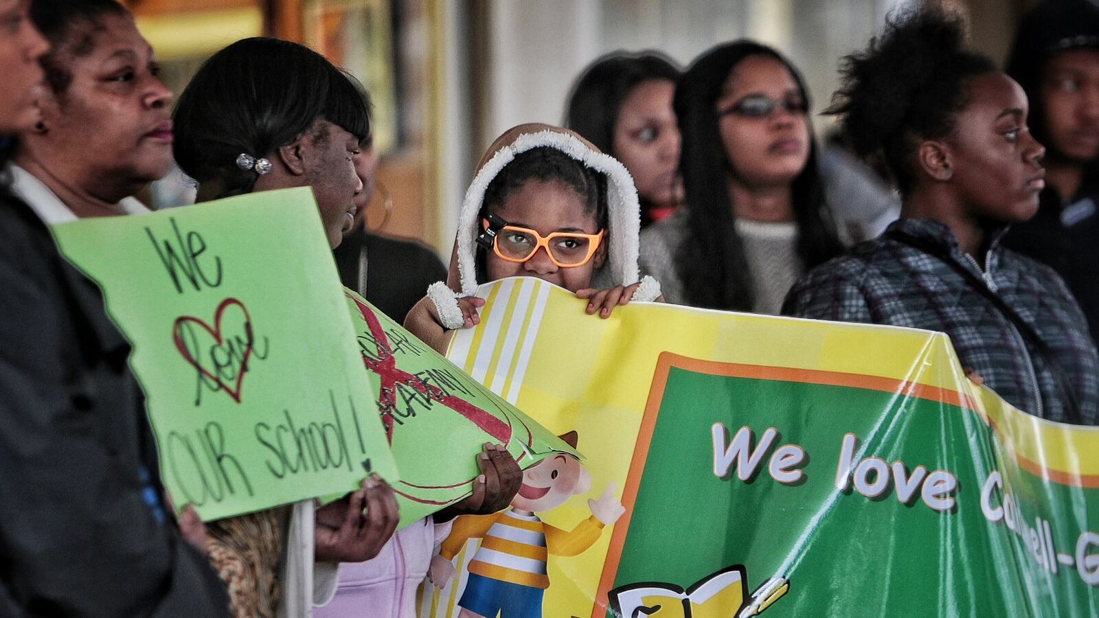 A student listens as parents and advocates protest the Achievement School District’s charter matching process in 2015.