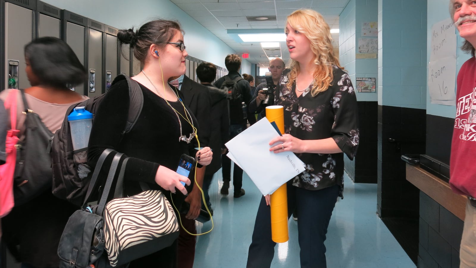 Misty Ayres-Miranda greets a student shortly after being surprised with a $25,000 cash prize.