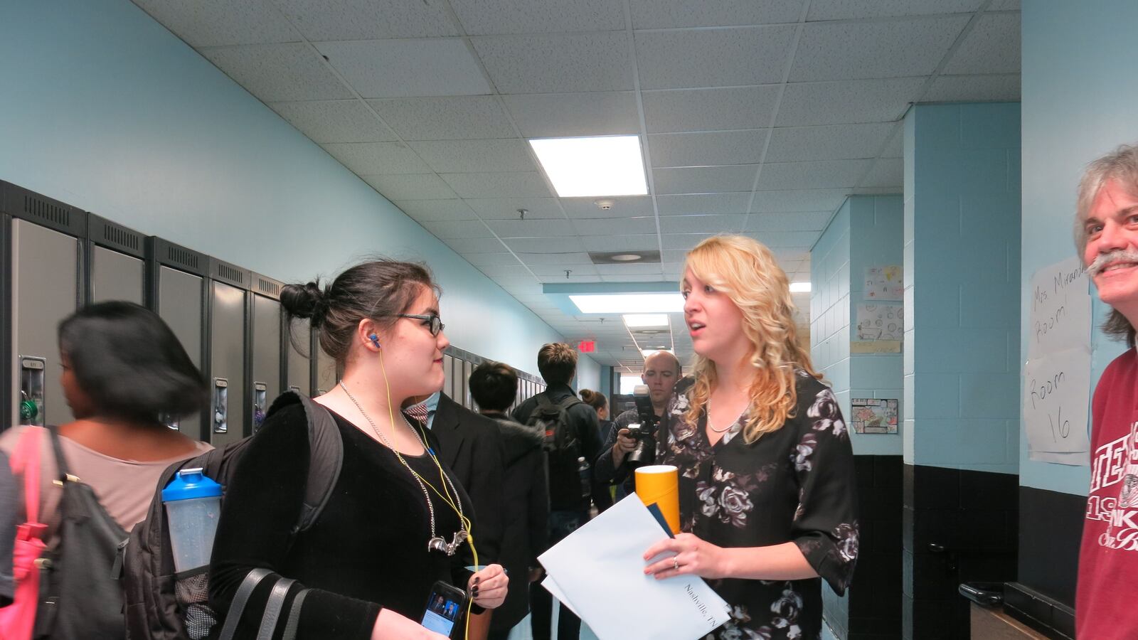 Misty Ayres-Miranda greets a student shortly after being surprised with a $25,000 cash prize.