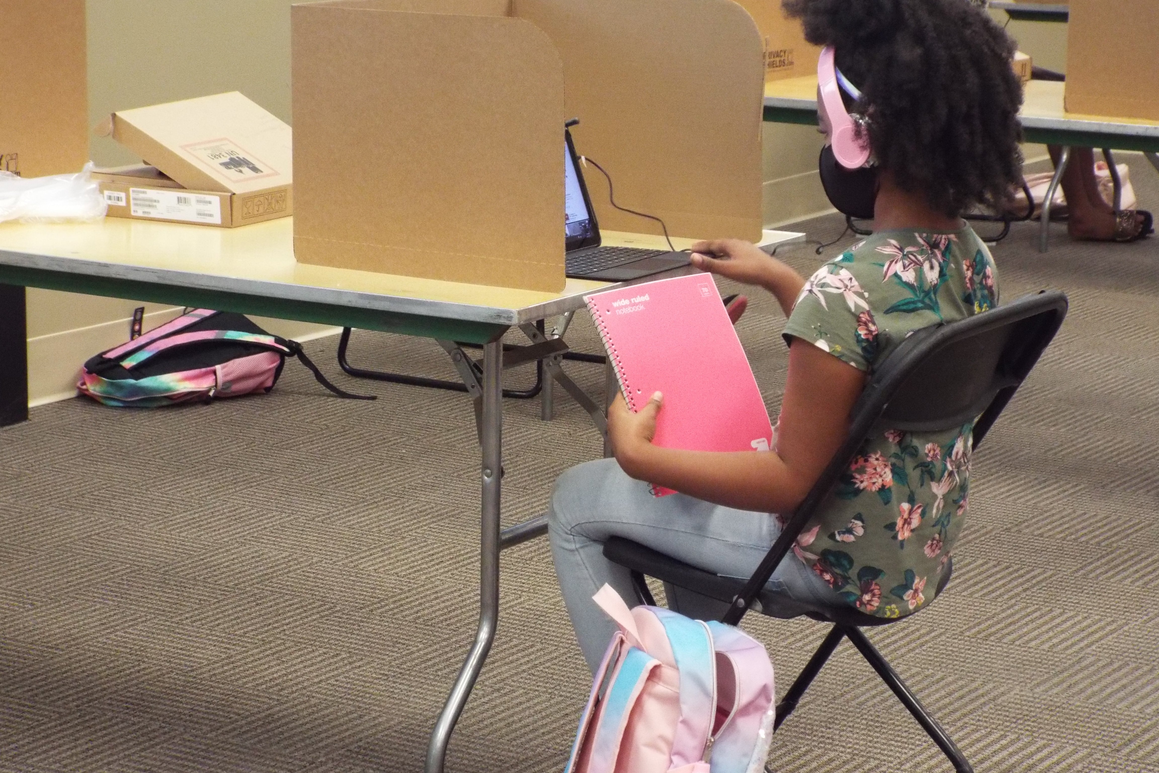 A student logs in remotely from the YMCA’s virtual learning center in Cordova on the first day of school.