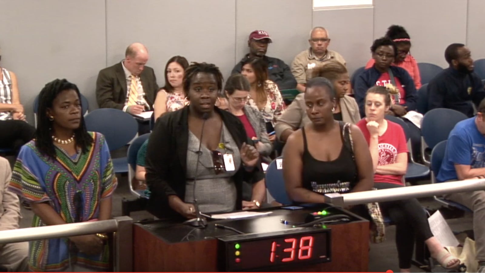 As the two-minute timer on the podium counts down, a  group of parents from Oglesby Elementary School lobby the new Chicago Board of Education in June for more support of their Montessori program.