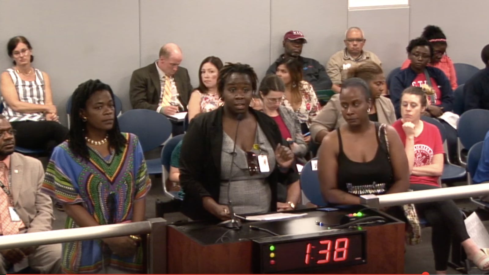 As the two-minute timer on the podium counts down, a  group of parents from Oglesby Elementary School lobby the new Chicago Board of Education in June for more support of their Montessori program.
