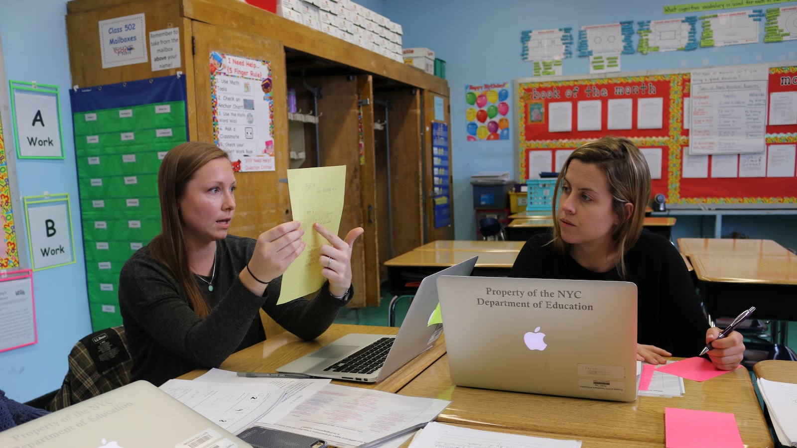 The math team at P.S. 294 in the Bronx discuss a recent lesson during the 80 minutes of professional development time carved out by the city's most recent contract with the teachers union.