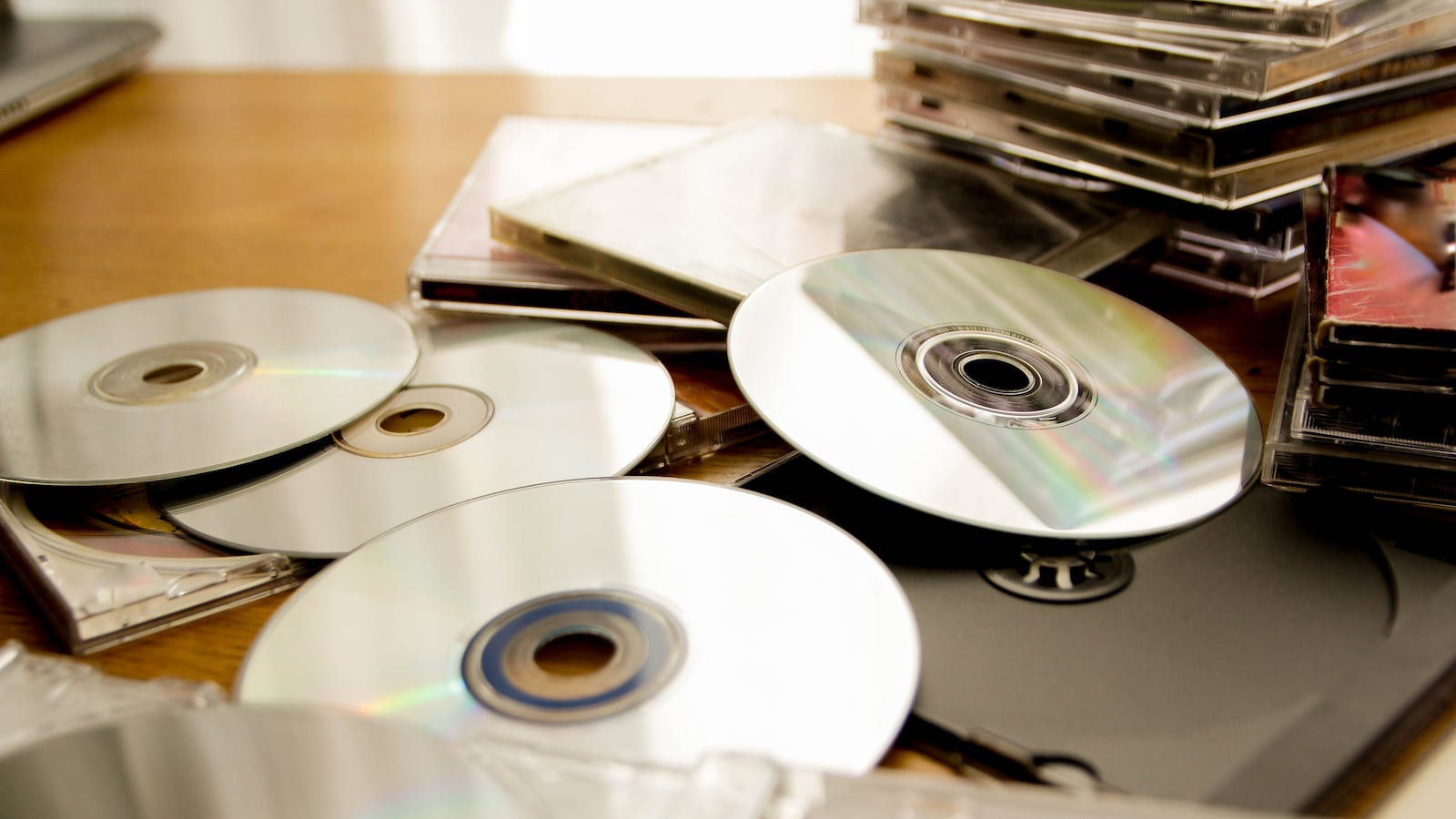 A pile of CDs and CD cases