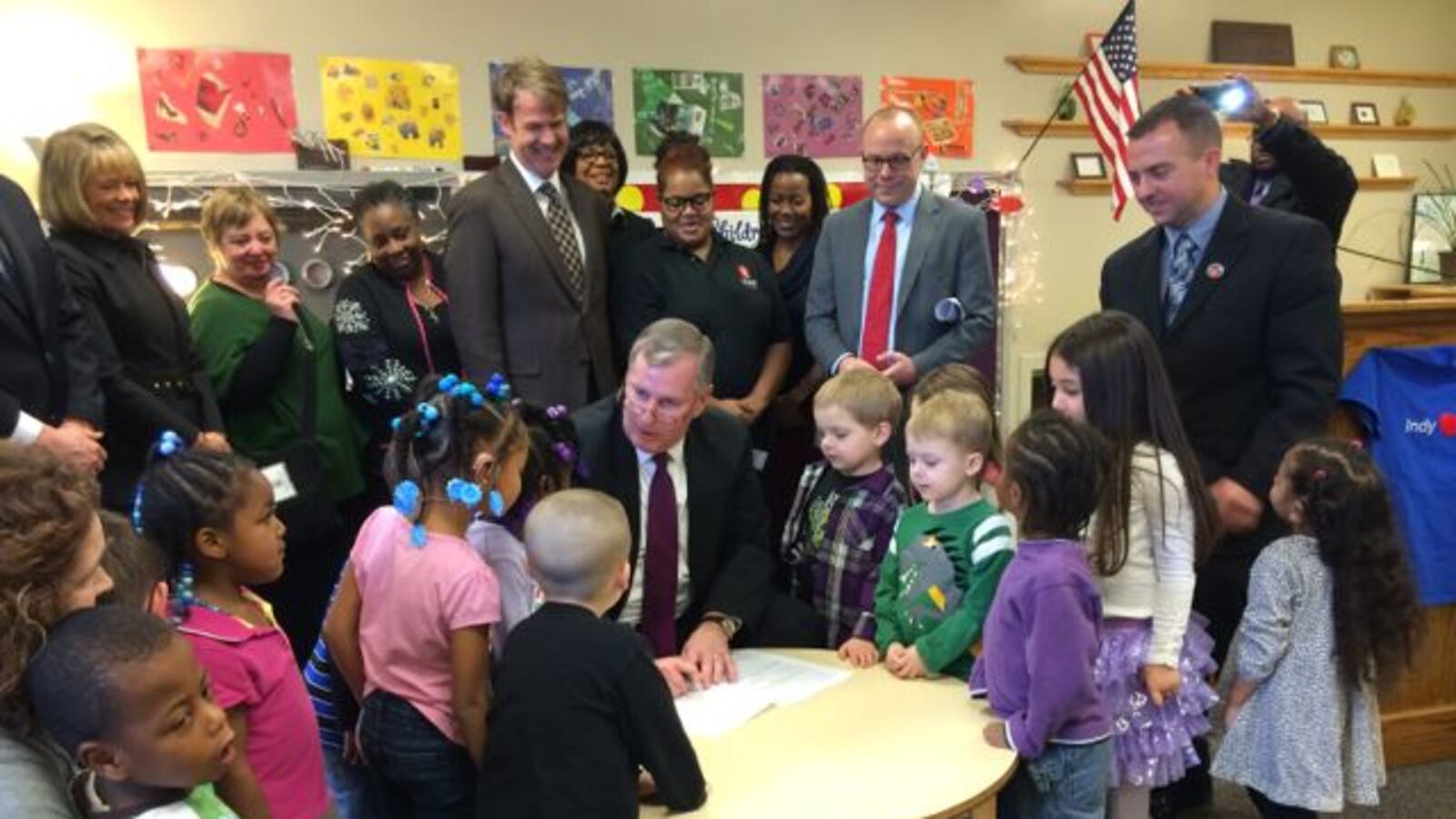 Mayor Greg Ballard signs the city's preschool ordinance at Warren Township Schools.