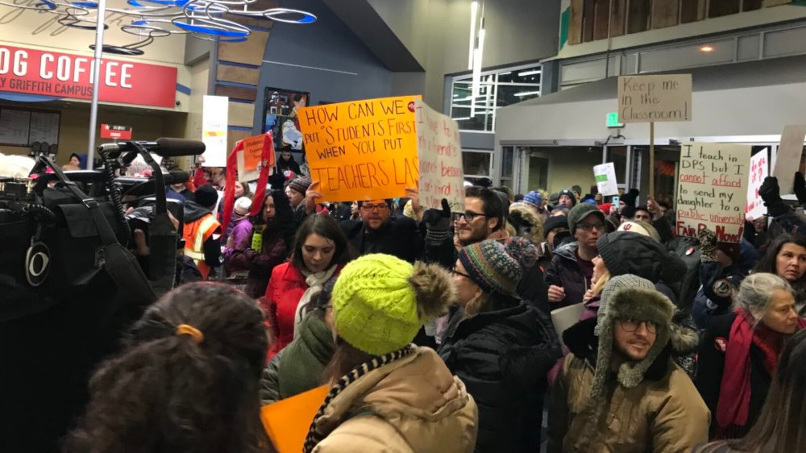 Denver teachers pack the lobby of the district headquarters to demand fair pay.