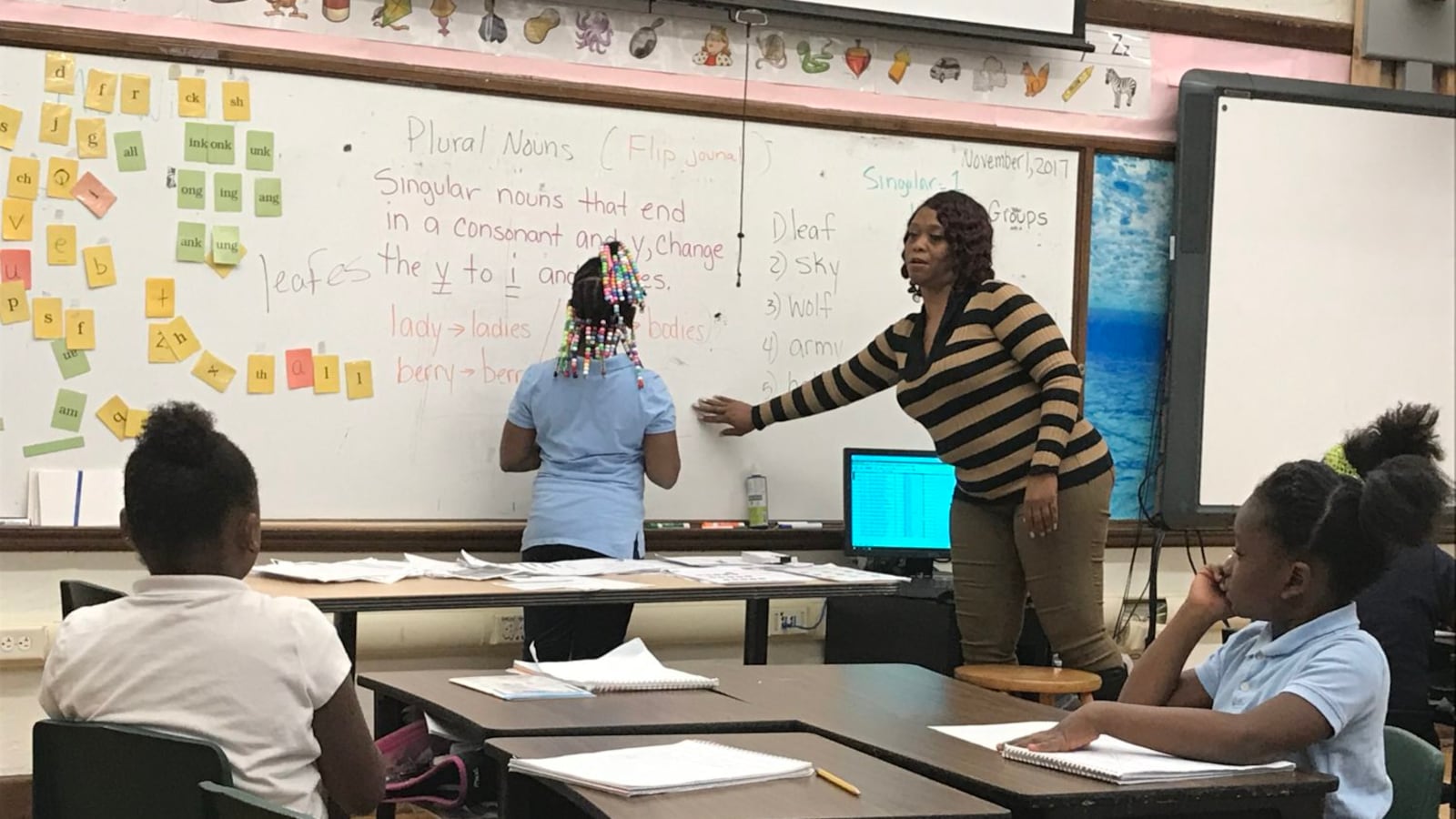 Second-grade teacher Angela Willis leads a reading lesson at Detroit's Bethune Elementary-MIddle School. Schools across the district will no longer be let out early on Wednesdays.