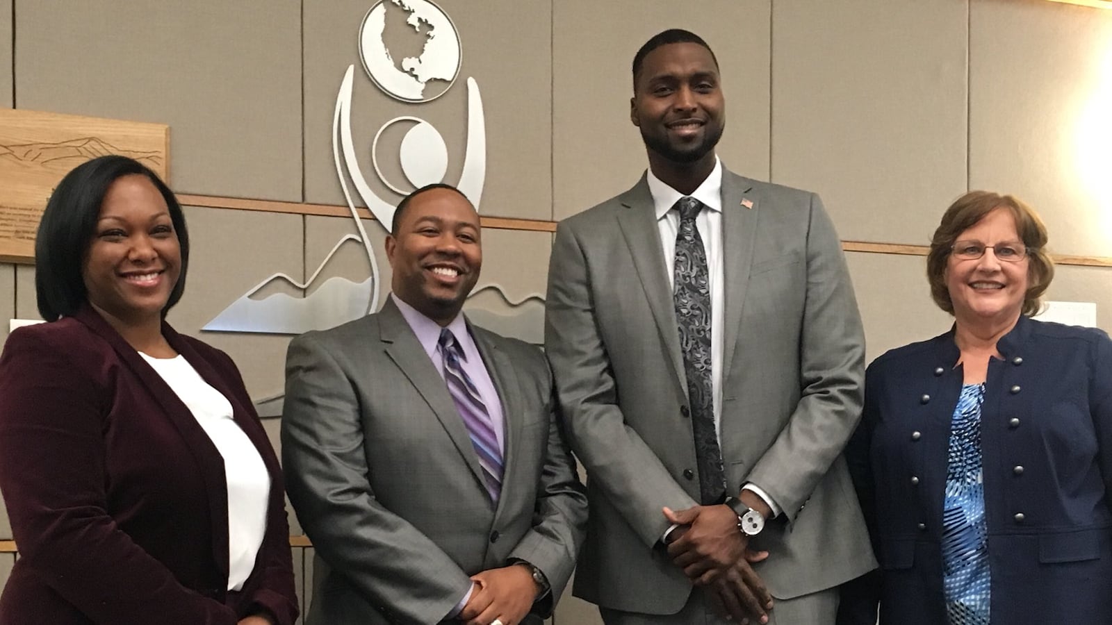 Four new board members, Kyla Armstrong-Romero, Marques Ivey, Kevin Cox and Debbie Gerkin after they were sworn in. (Photo courtesy of Aurora Public Schools)